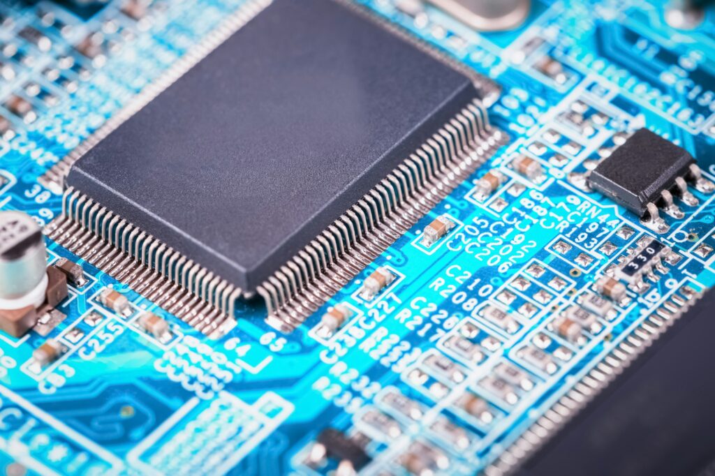 Close-up of a computer motherboard undergoing repair
