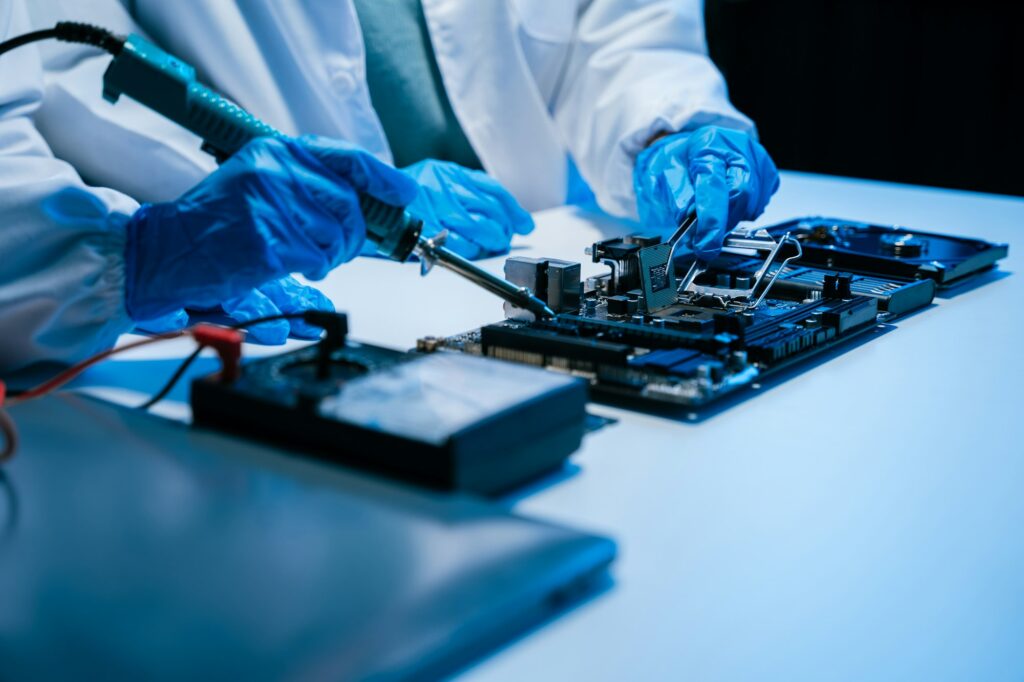 Close-up of component-level electronics repair