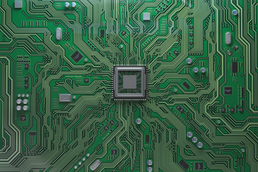 Technician performing component-level repair on a logic board