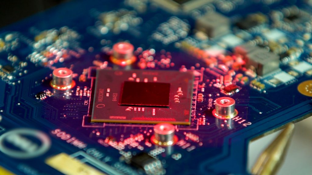 Close-up of a circuit board undergoing component-level repair