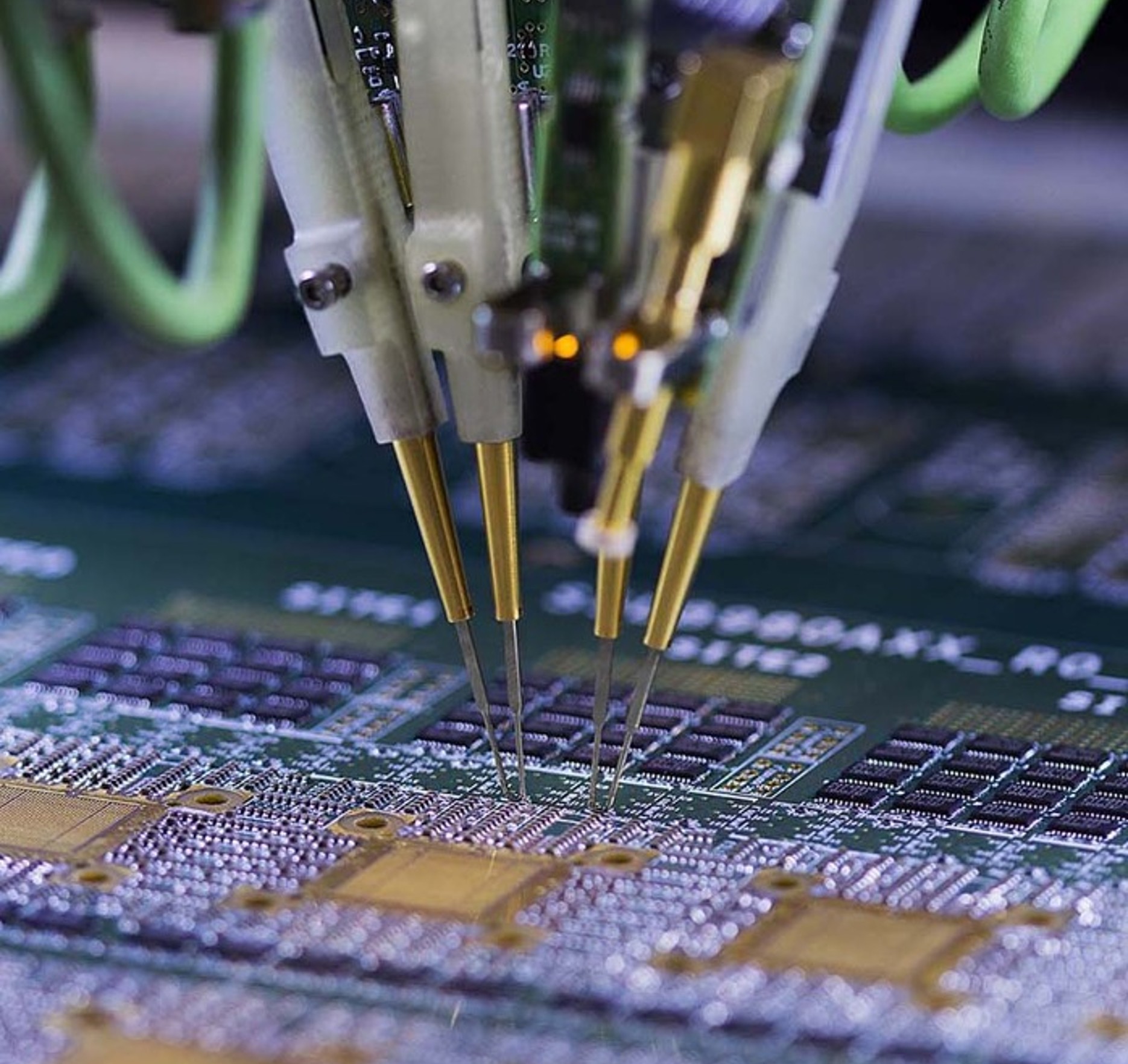 Flying-probe test needles contacting a circuit board during electrical test