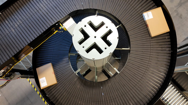 Overhead view of cartons descending a spiral conveyor in the distribution center