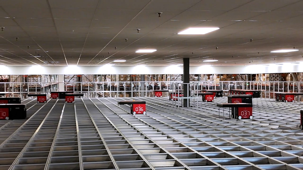 AutoStore automated storage grid with robots retrieving bins at the CSAT distribution center